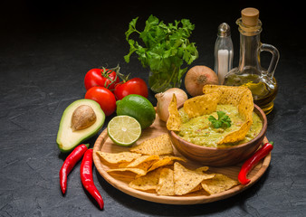 Bowl of delicious homemade Guacamole with nachos