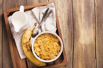 Tasty and healthy breakfast on wooden tray