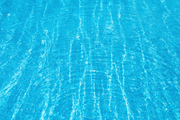 Ripple Water in swimming pool witn sun reflection
