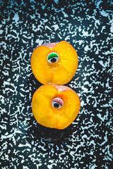 Naklejka na ściany i meble a contemporary still life of a peach on trendy colored background