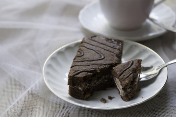 Cup on the table and cake