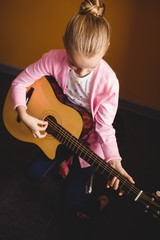 Girl playing the guitar