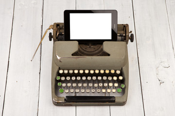 Concept of technology progress - old typewriter - -- new tablet pc