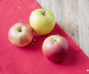 apples on a red cloth