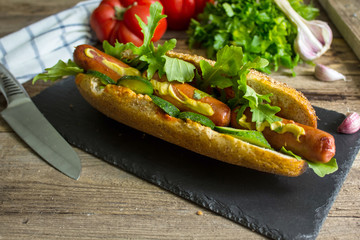 homemade hot dog on a black plate