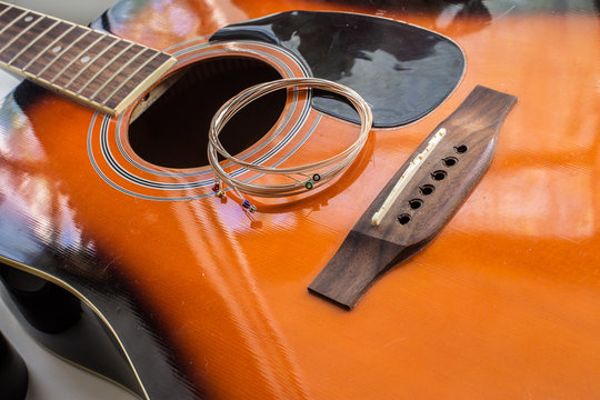 New guitar strings put on the acoustic guitar