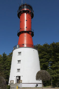 Lighthouse on a sunny day with blue sky.