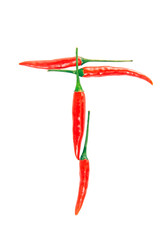 T Letter from red hot pepper on the white