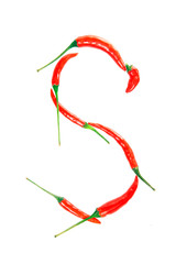S Letter from red hot pepper on the white