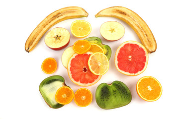 different fruit whole and sliced on white background