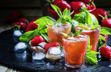 Alcoholic cocktail strawberry mojito with white rum, syrup, soda