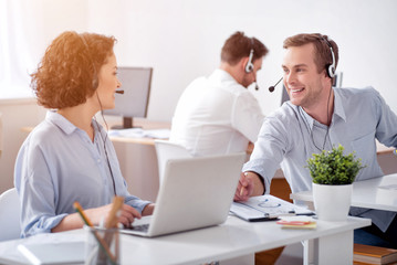 Obraz premium Positive colleagues working in the office 