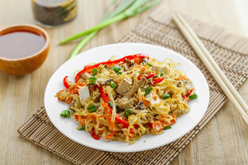 Traditional Asian meal made of rice noodles, vegetables, tofu and shiitake mushroom. Oriental cuisine food.