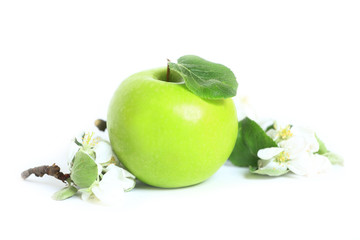 green apple with a leaf on a white background