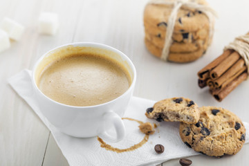 Cup of coffee with sweet homemade cookies. Coffee break with chocolate biscuits.