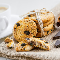 Cookies with chocolate on a table for dessert. Fresh biscuits with coffee for breakfast.