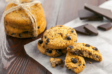 Fresh homemade biscuits on a baking paper. Delicious cookies with chocolate.