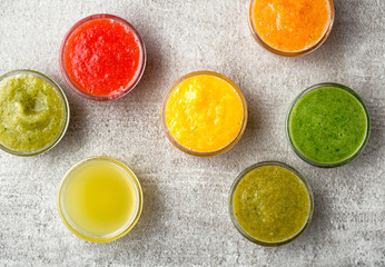 various smoothies on gray kitchen table