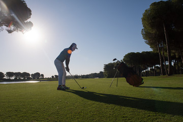 golf player hitting shot