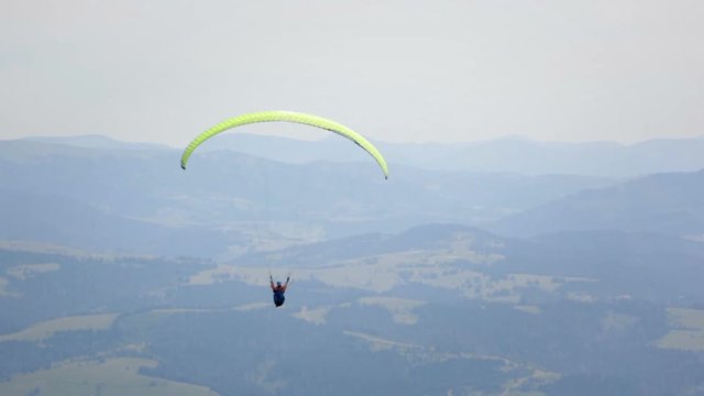 Paraglider in mountains