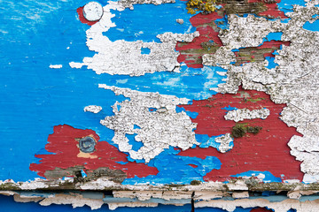 Peeling paintwork on a derelict boat at Dungeness