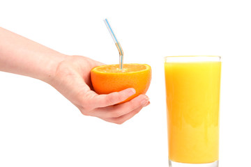 Human hand gesturing with fresh orange and full glass of orange juice taken on white background