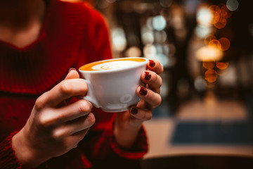 Woman drinking cappuccino