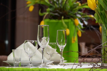 Decoration of the holiday table yellow tulips./Decoration of the holiday table yellow tulips.