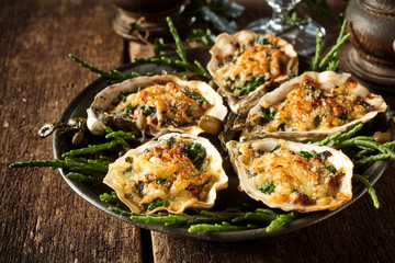 Oysters with Cheesy Gratin Topping Served on Plate