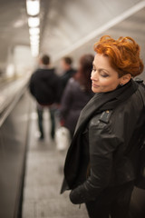 Woman in the metro escalator tounel