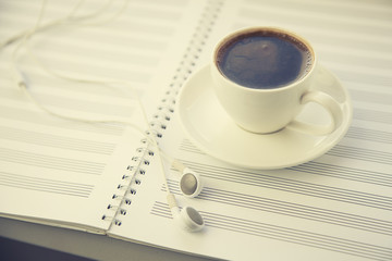 coffee on musical notes notebook