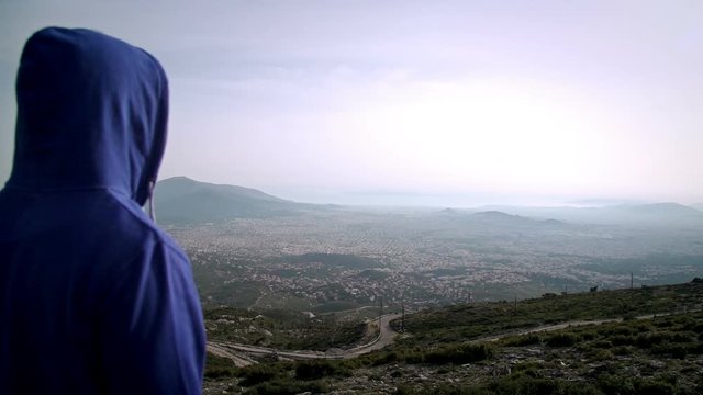  	Cyclist On The Top Of the City