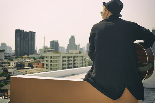 On the rooftop with guitar