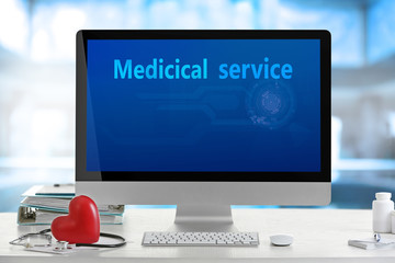 Medical service interface on computer in doctor office