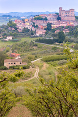 medieval village and cultivated fields in the hills