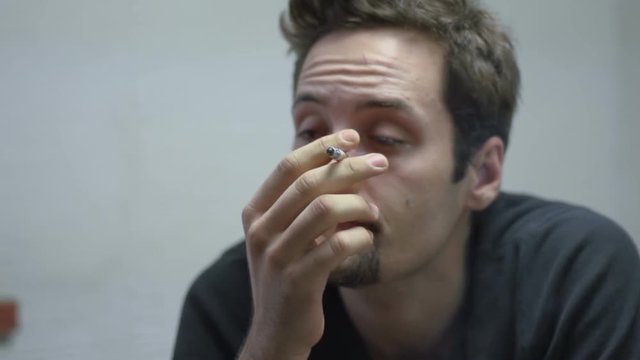 SUPER 35MM CAMERA - Man smoking a cigarette
