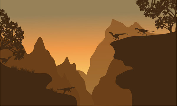 Silhouette of eoraptor in cliff
