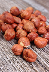 Heap of brown hazelnut on wooden table