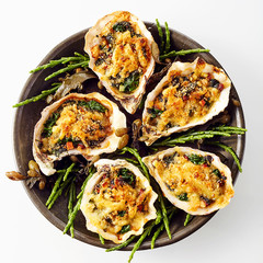 Oysters with Cheesy Gratin Topping Served on Plate