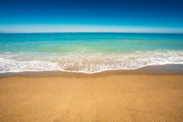 Soft Sea Ocean Waves Wash Over Golden Sand Background. Sea water