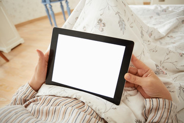 Selective focus. Adult woman holding digital tablet with blank c