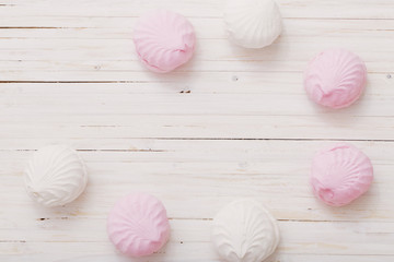 hite marshmallow - zephyr on a light wooden table