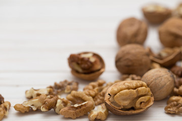 walnuts on white wooden background