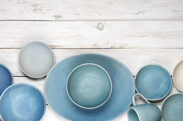 Blue crockery on white wood