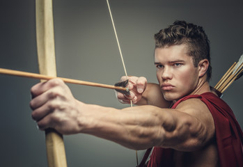 Muscular male model with bow.