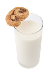 Glass of milk and cookie isolated over the white background