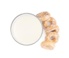 Glass of milk and cookie isolated over the white background
