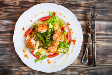 Tasty shrimps salad green beans and cherry tomatoes. Top view