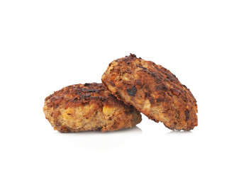 Couple of small hand made cutlets isolated over white background