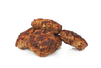 Pile of small hand made cutlets isolated over white background